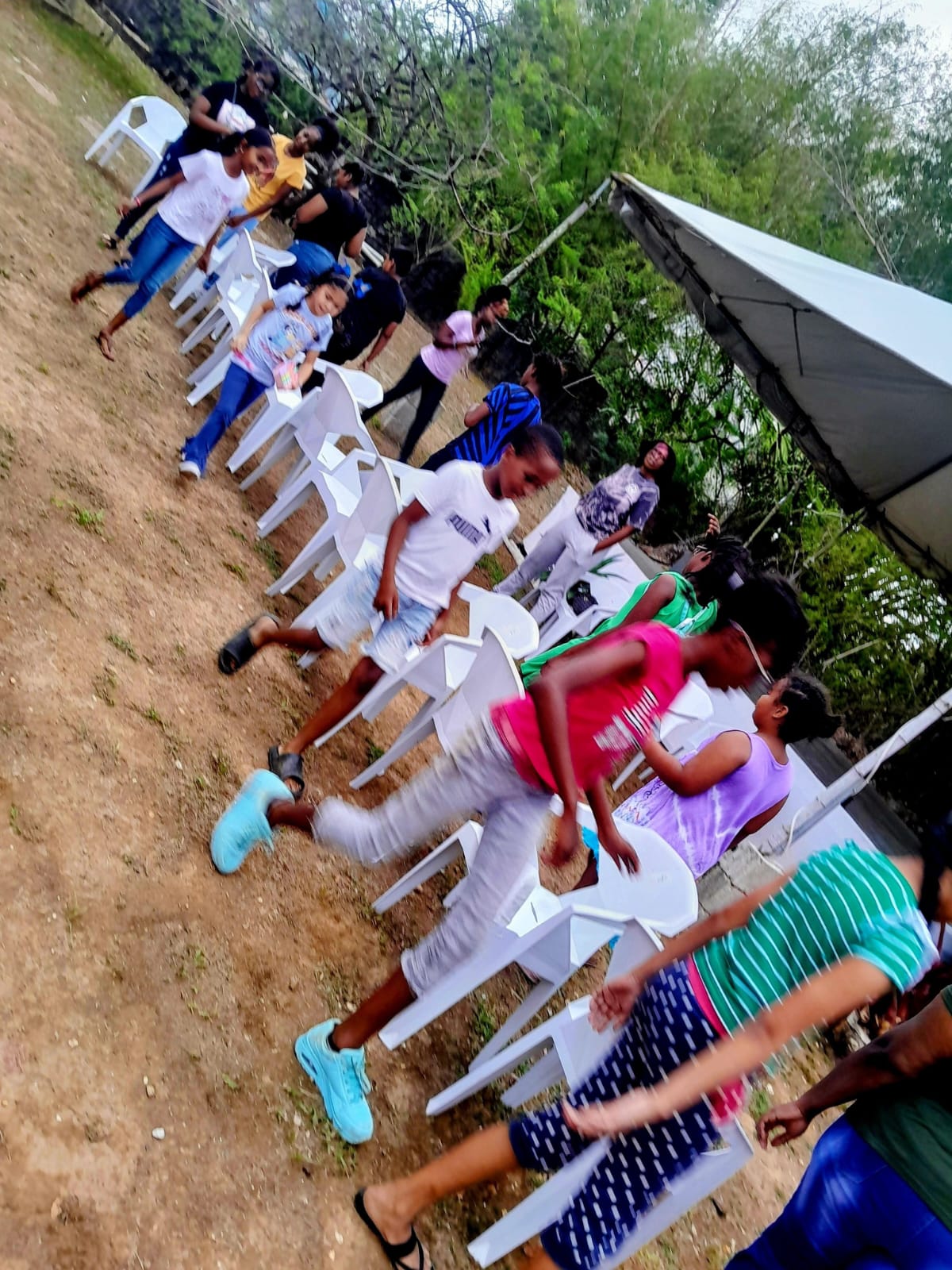 Children playing musical chairs at a youth activity hosted by Arouca Soul Kitchen in Arouca, Trinidad Children playing musical chairs at a youth activity hosted by Arouca Soul Kitchen in Arouca, Trinidad