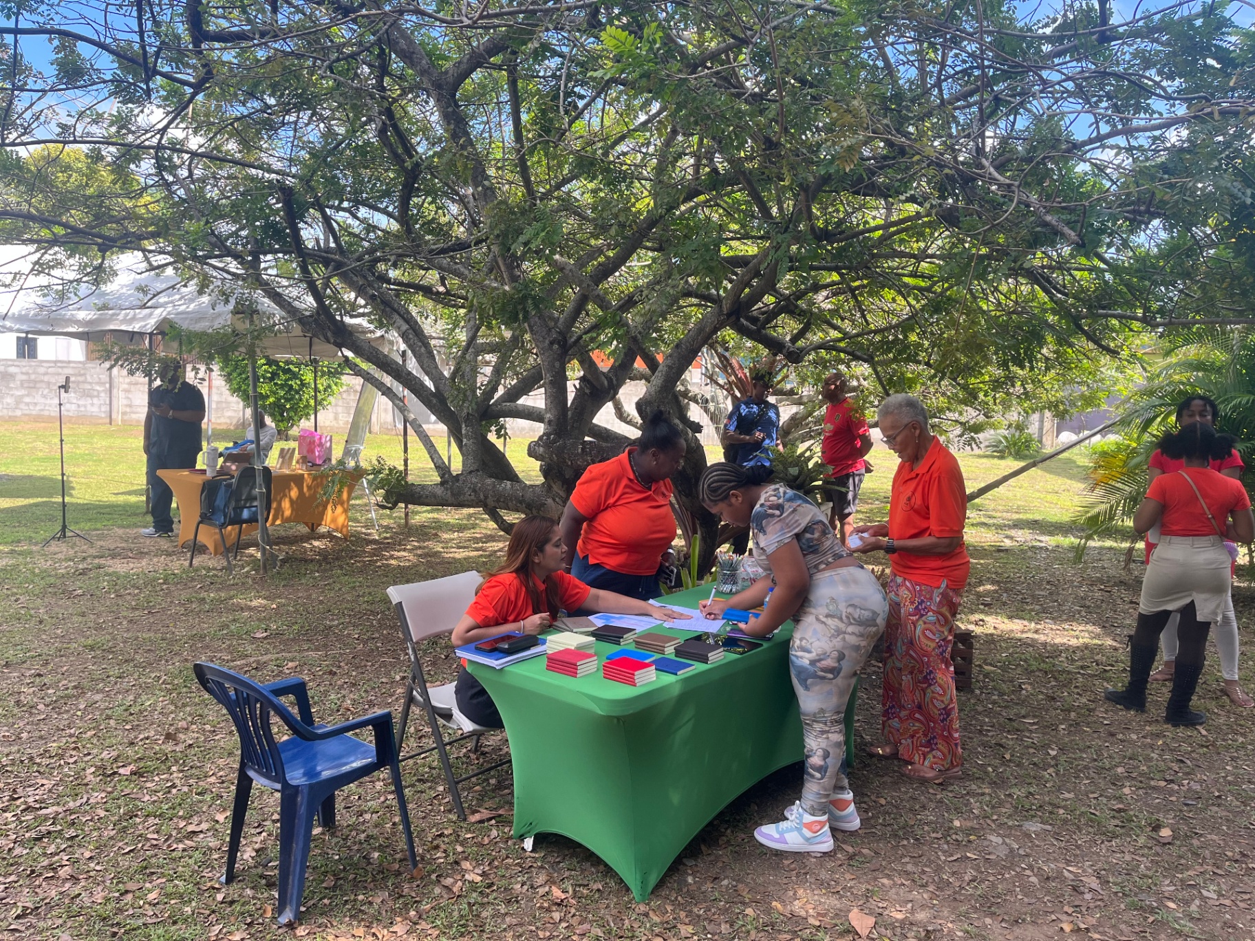 Directors of Arouca Soul Kitchen greeting attendees at a community event in Arouca, T&T Directors of Arouca Soul Kitchen greeting attendees at a community event in Arouca, T&T