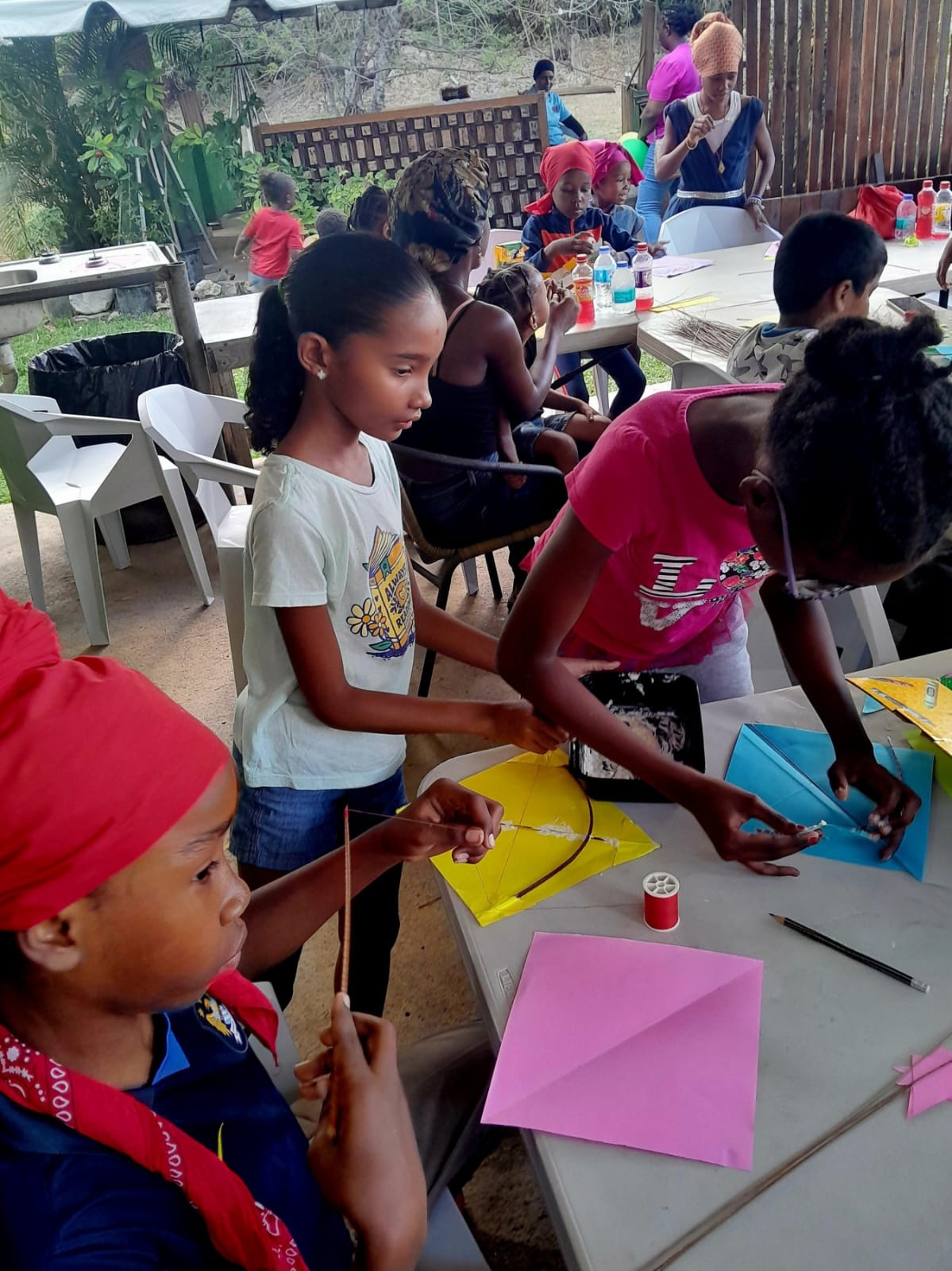 Children creating custom kites at an Arouca Soul Kitchen community event in Trinidad and Tobago Children creating custom kites at an Arouca Soul Kitchen community event in Trinidad and Tobago