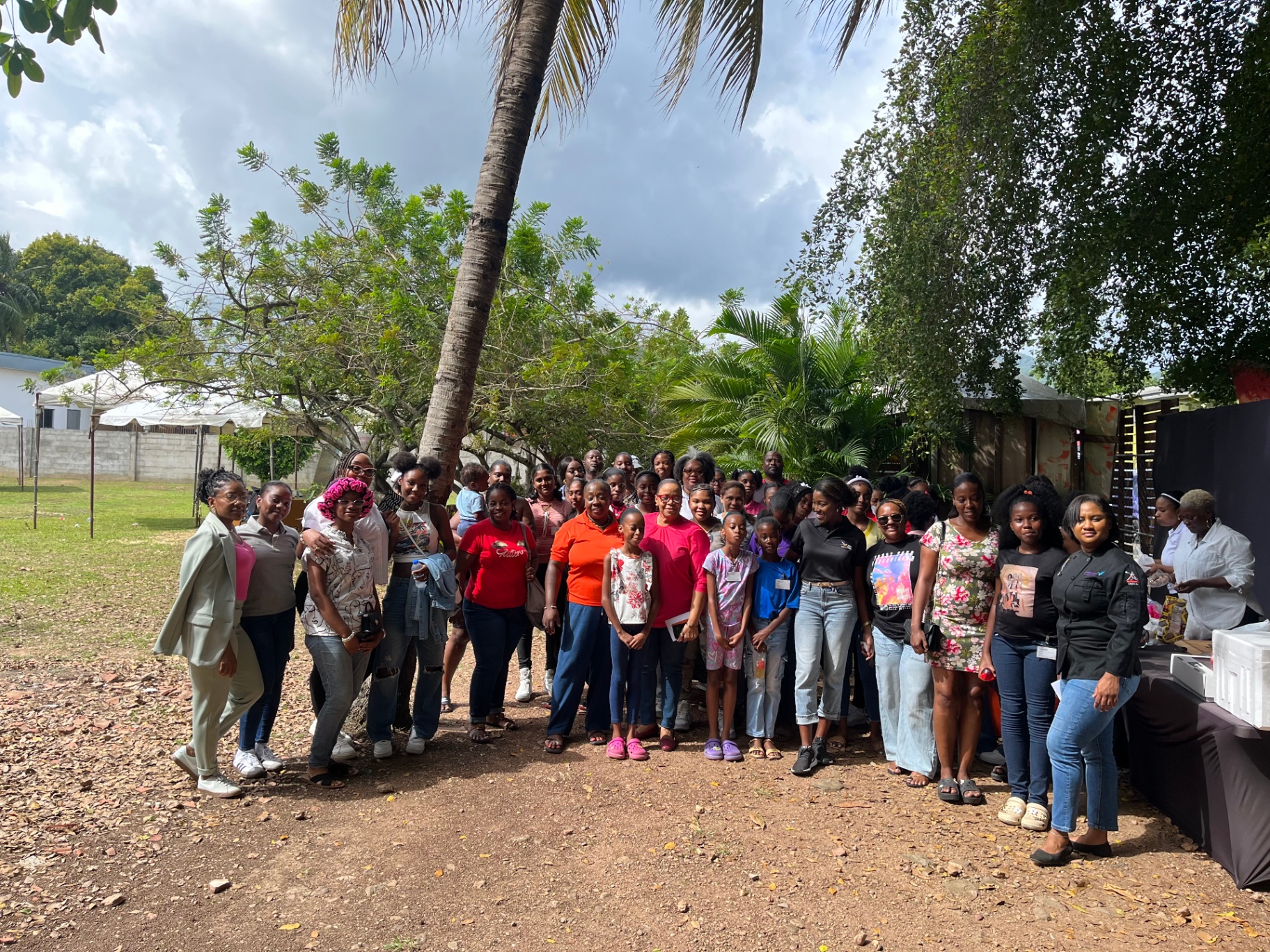 Group photo of all attendees at an event hosted by Arouca Soul Kitchen in Trinidad and Tobago Group photo of all attendees at an event hosted by Arouca Soul Kitchen in Trinidad and Tobago